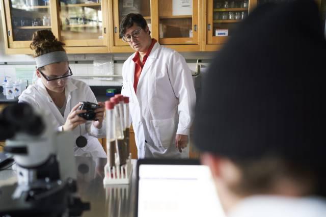 student and professor in biology lab